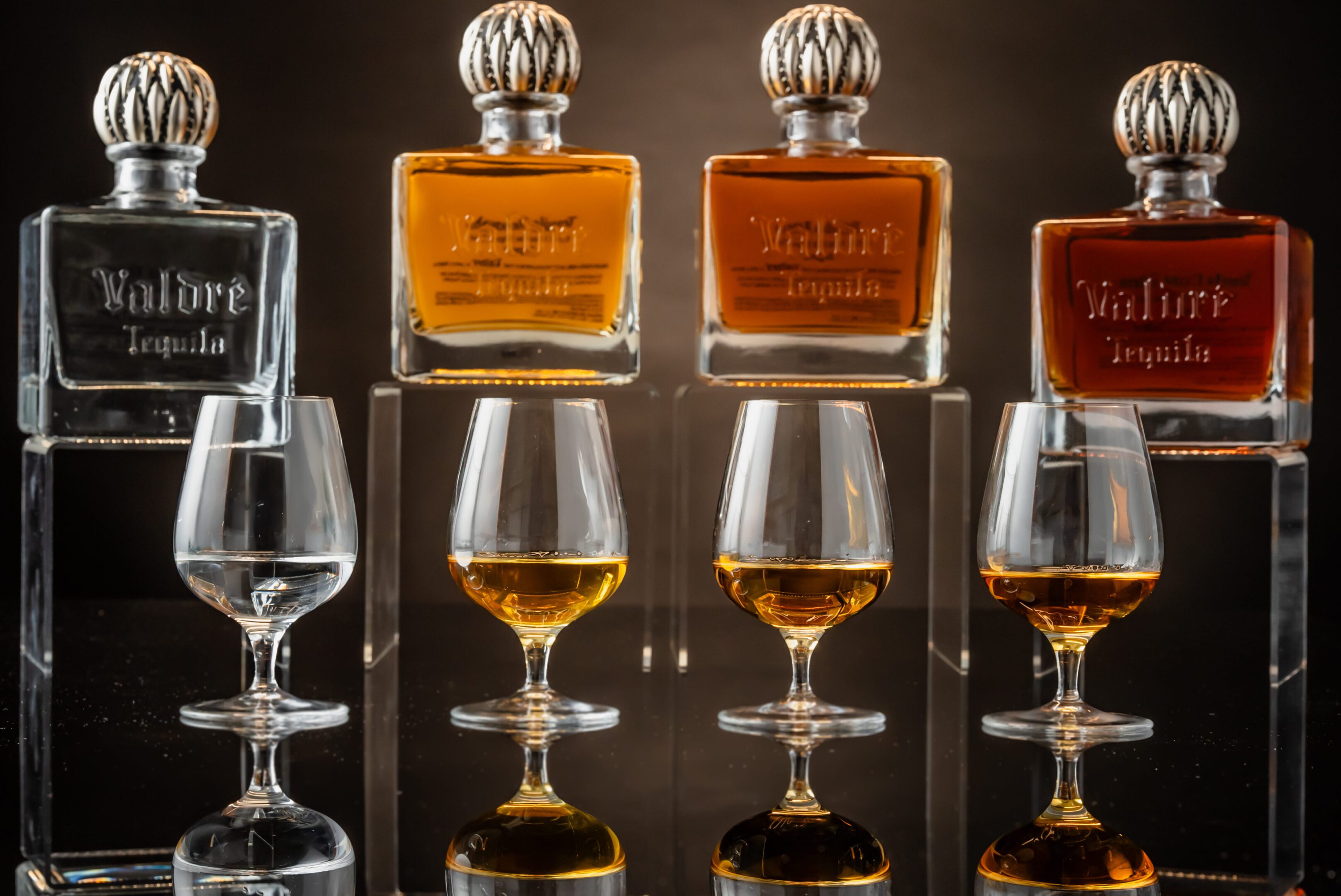 A group of glasses with some different types of alcohol.