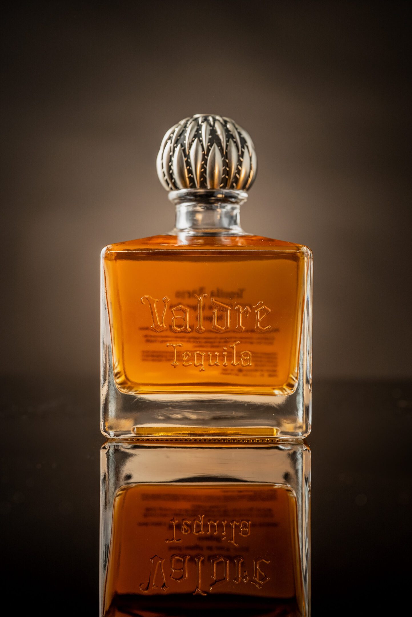 A bottle of perfume sitting on top of a table.