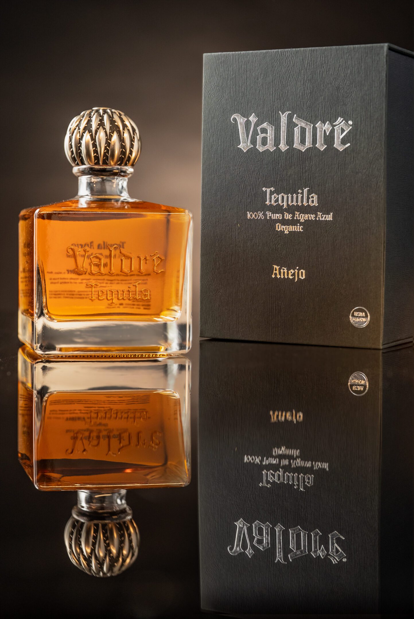 A bottle of tequila sitting on top of a table.
