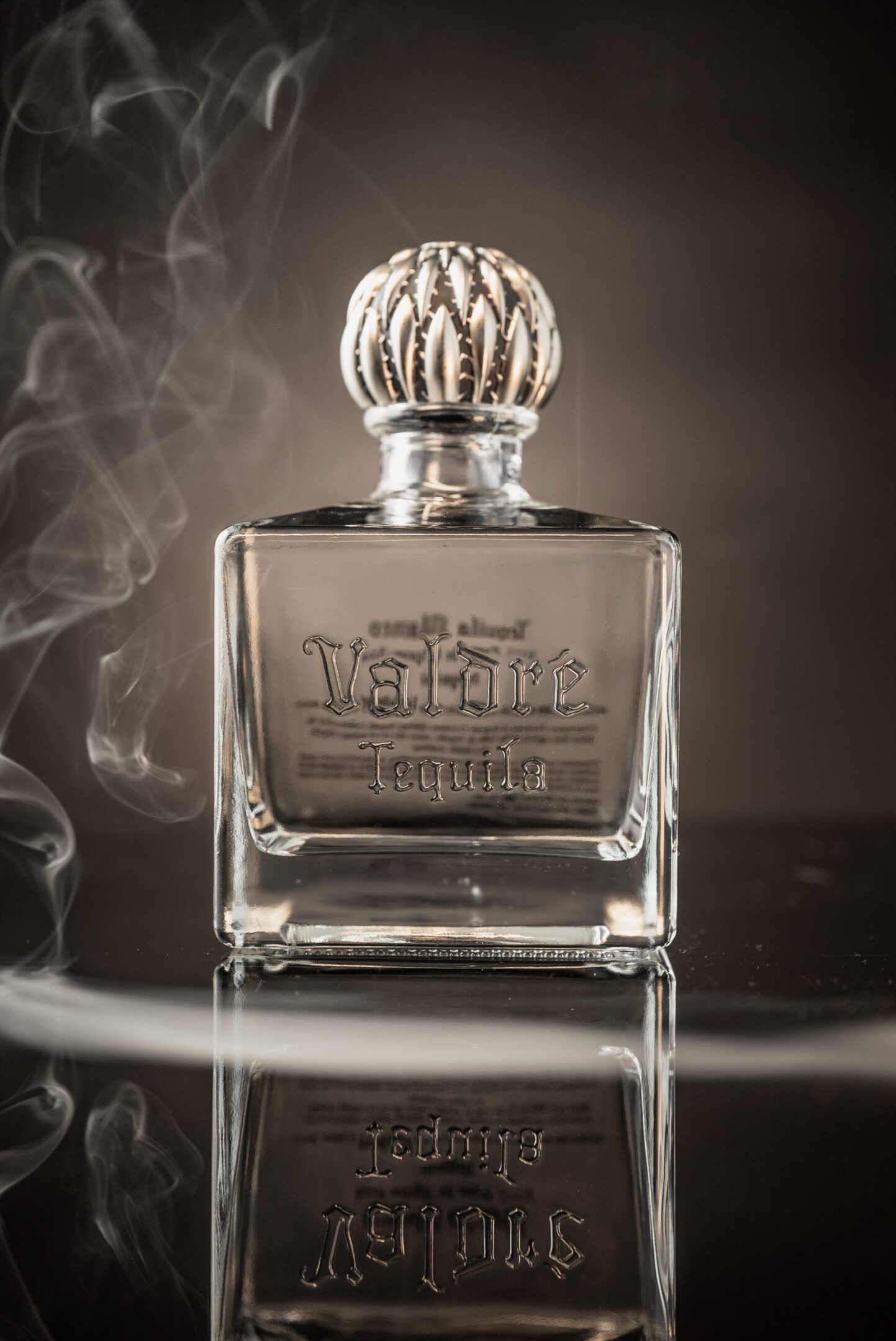 A bottle of perfume sitting on top of a table.