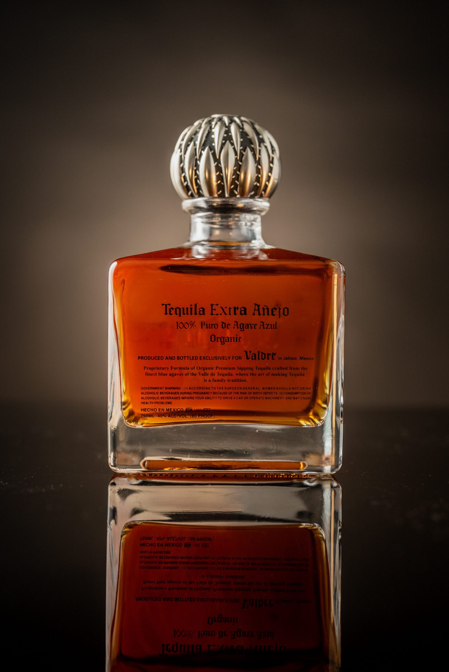 A bottle of whisky on top of a table.