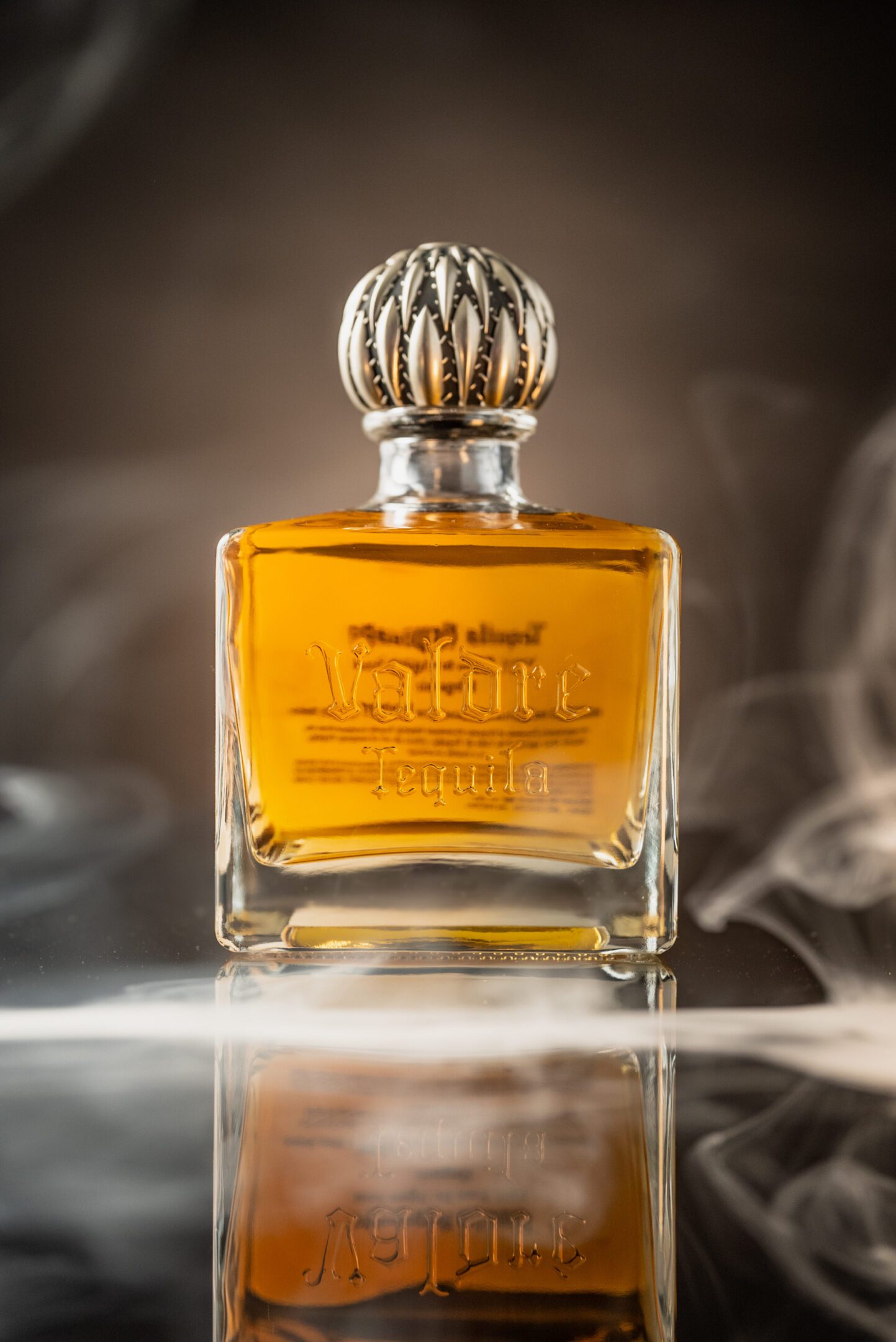 A bottle of perfume sitting on top of a table.