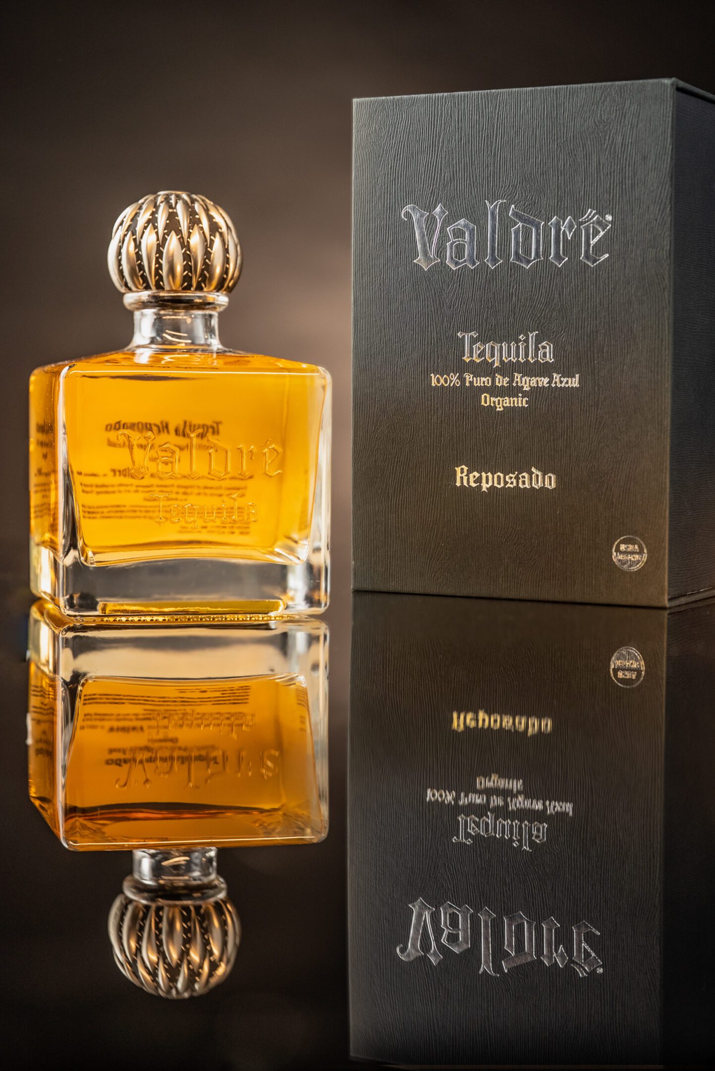 A bottle of tequila sitting on top of a table.