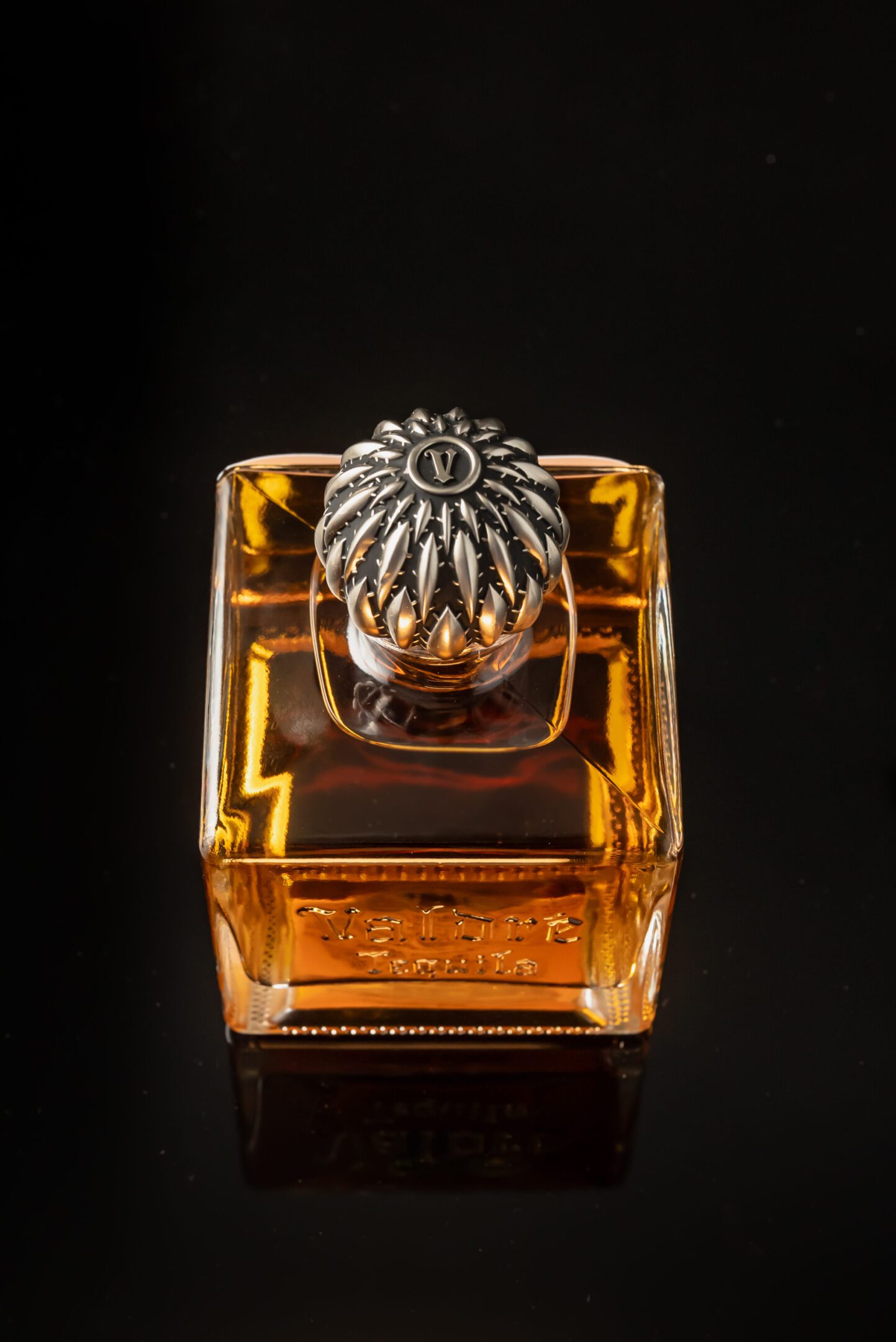 A bottle of perfume sitting on top of a table.
